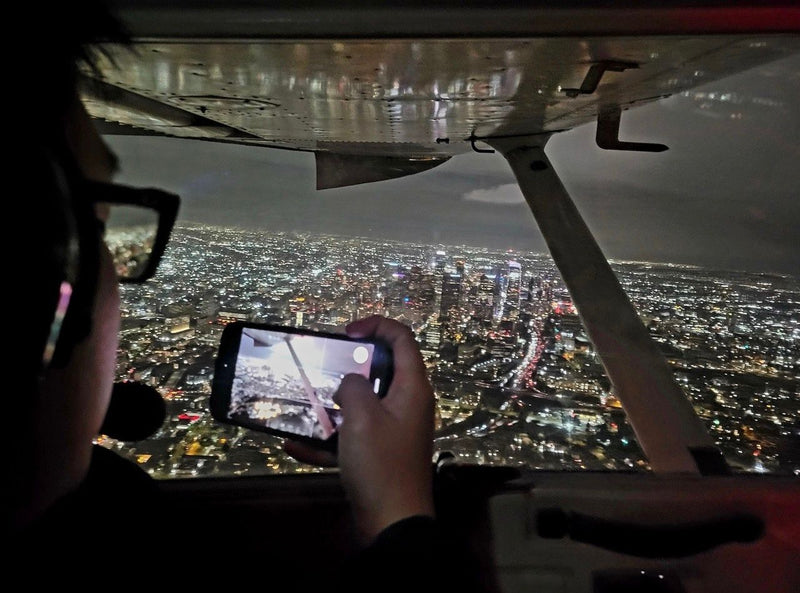 taking-a-photo-of-city-at-night