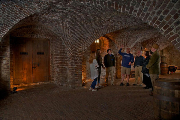 The Charleston Ghost and Dungeon Tour guide giving history of dungeon.jpeg