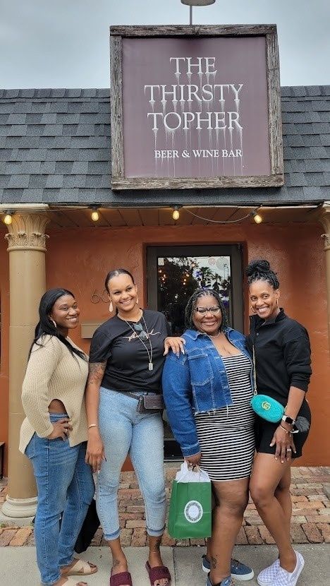 thirsty-topher-ladies-in-front-of-sign-jpg