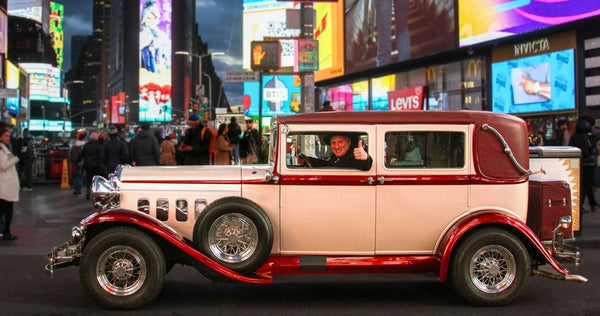 thumbs up in vintage car