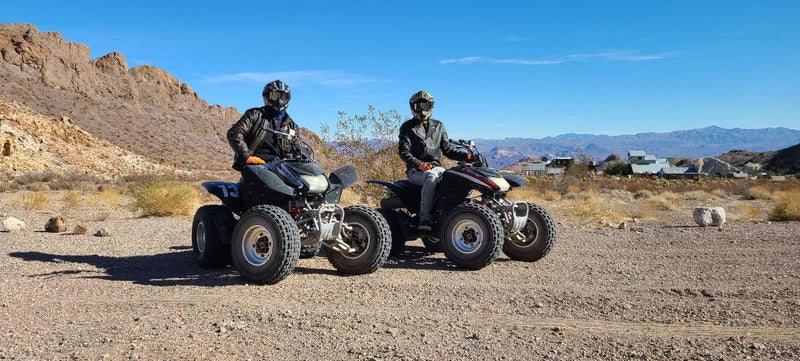 two-people-on-atvs