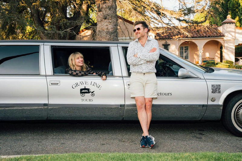 two people with grave line limo