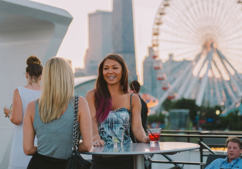 two-women-chatting-on-a-signature-dinner-cruise-in-chicago