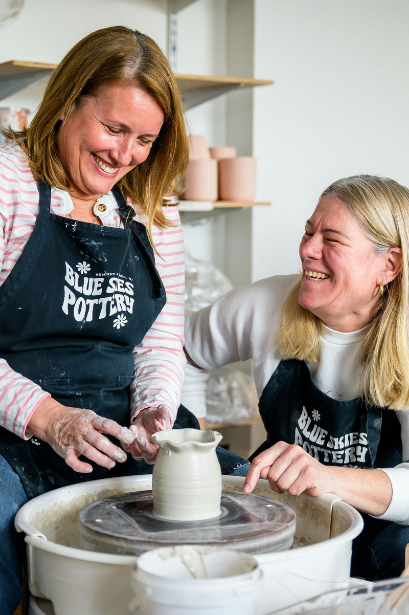 two women doing pottery