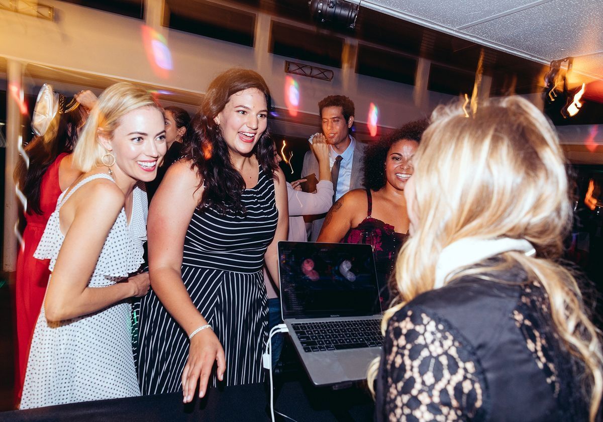 two-women-requesting-a-song-on-a-dinner-cruise