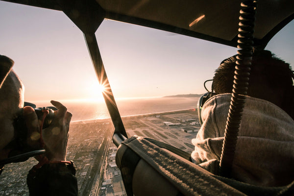 Photographer shooting out of heli
