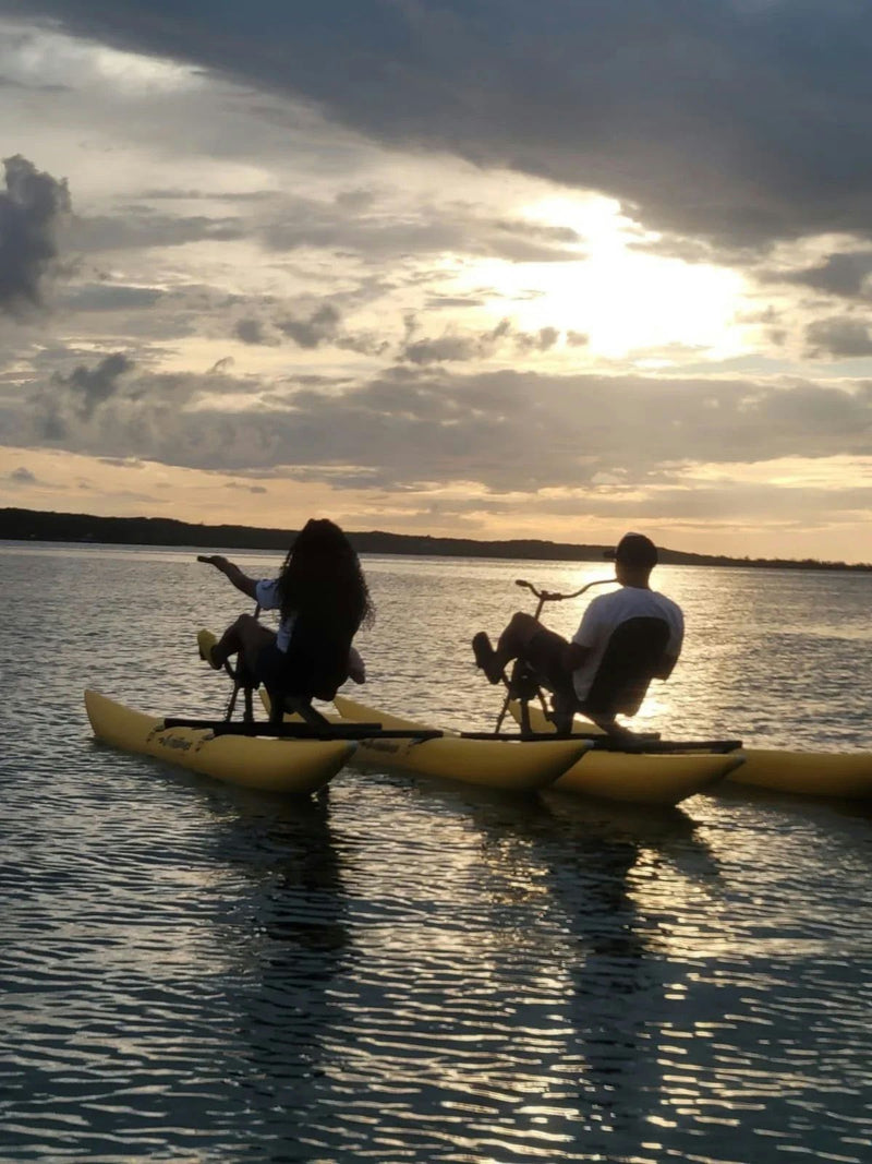 water bikes at sunset