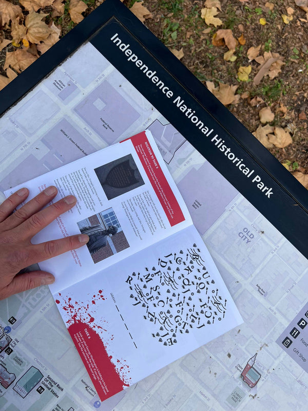 hand holding booklet in philly