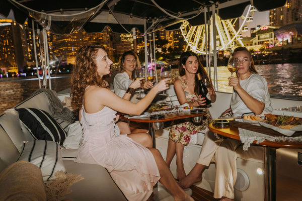 wine-on-boat-at-night