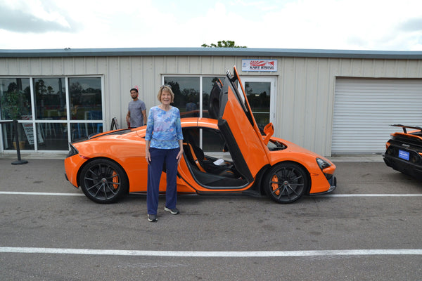 woman and sports car