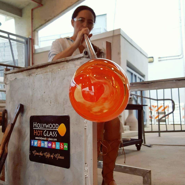 woman blowing glass
