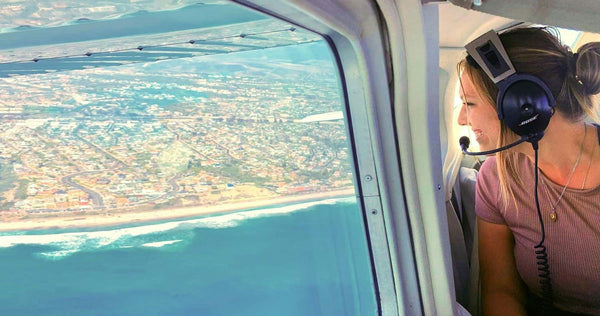 woman looking out plane window.jpg