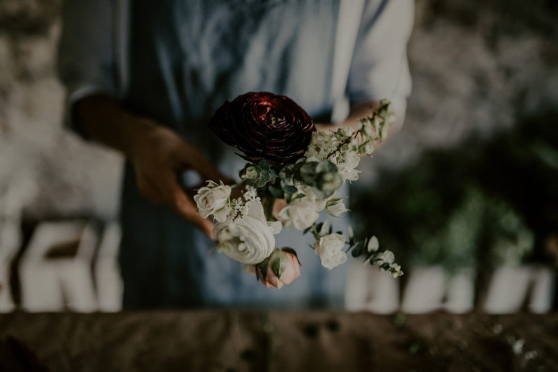woman making a floral arrangement zoomed