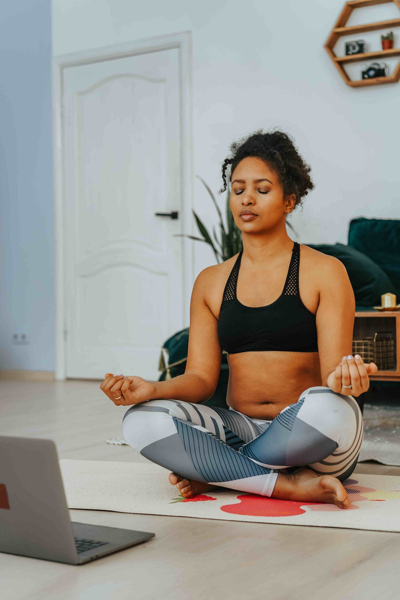 woman-meditating-during-a-virtual-yoga-class