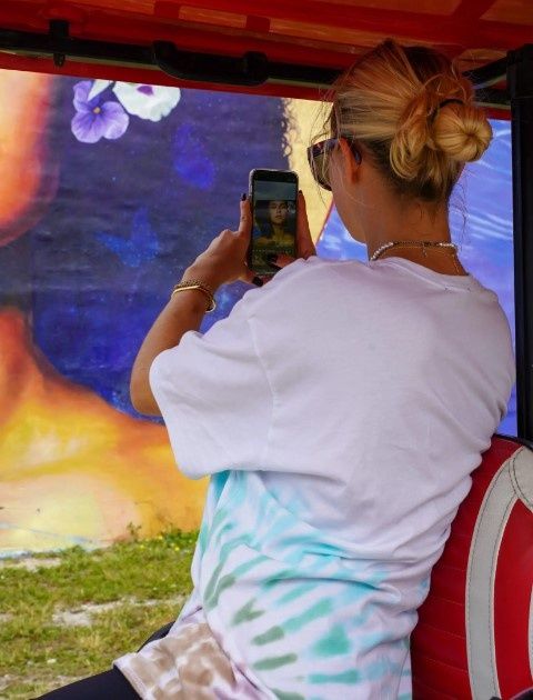 woman-taking-photo-of-street-art