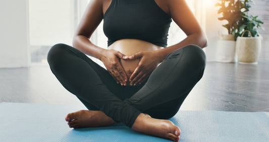 3 women doing prenatal yoga