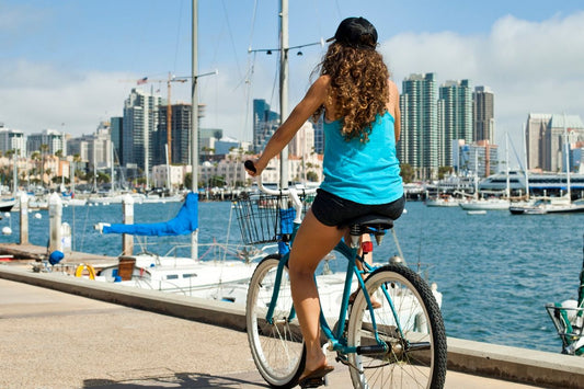woman on bike by docks