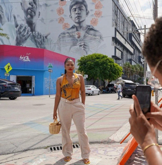 woman posed for photo with street art