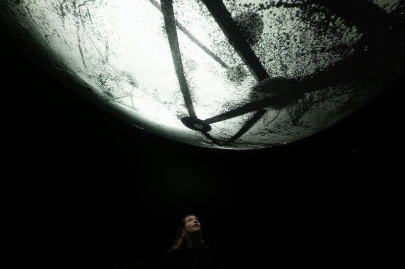 womane-looking-at-moon-installation
