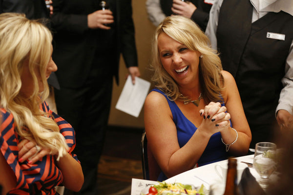 women laughing ta show