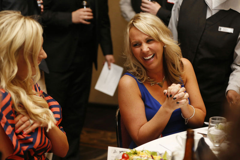 women laughing ta show