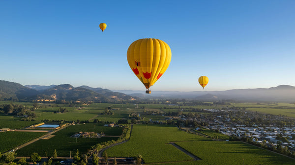 yellow balloon takaing off