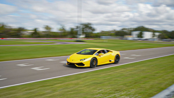 yellow super car racing