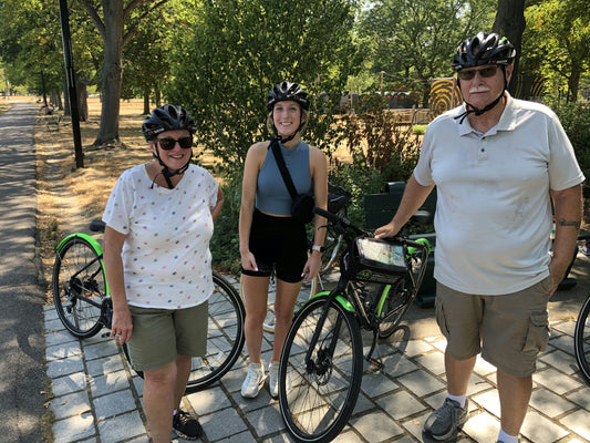 family on bike tour with helmets