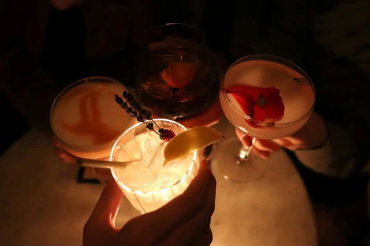holding fancy cocktails