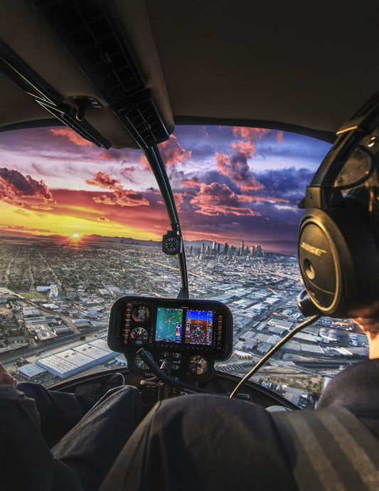 pilot flying at sunset