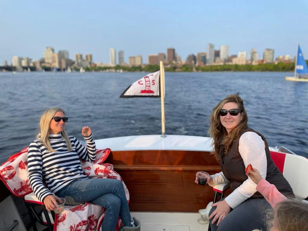 women chilling on boat